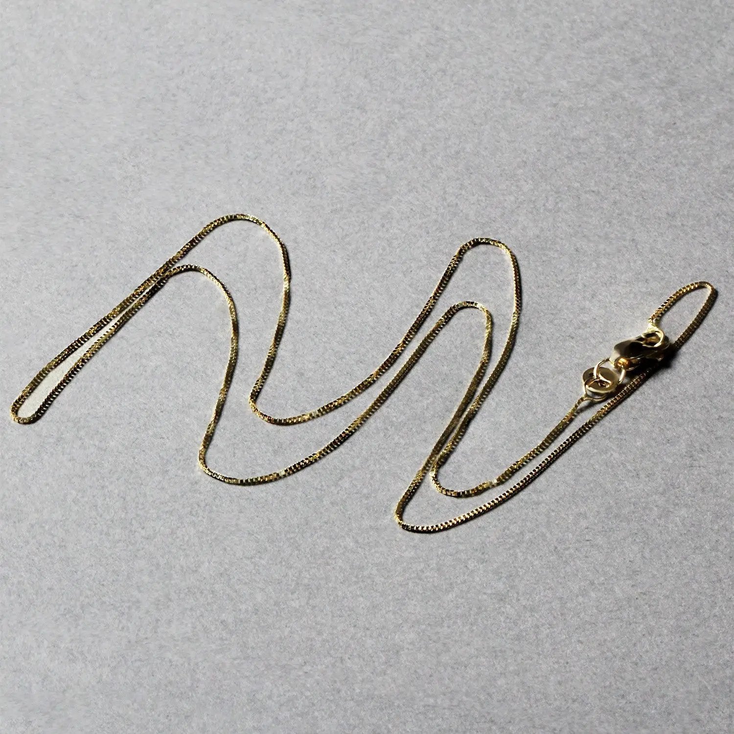 Box chain necklace 14k yellow gold 0.45mm, two pieces shown, by Bids.com on Tampa Home & Garden Store
