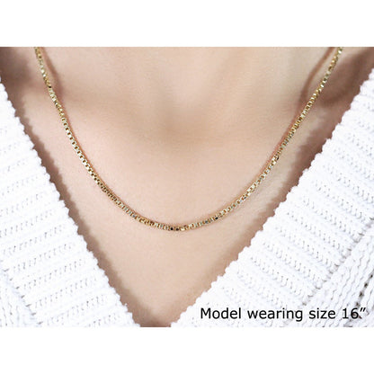 14k yellow gold box chain necklace 1.6mm branded Bids.com on model wearing white knit on Tampa Home & Garden Store
