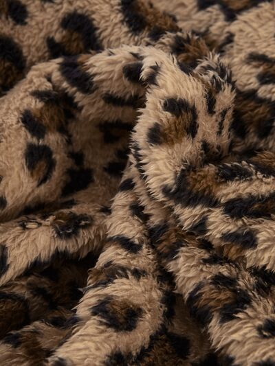 Trendy fuzzy leopard hooded jacket fabric closeup in beige-brown faux fur by Stevvex Coats on Tampa Home & Garden Store