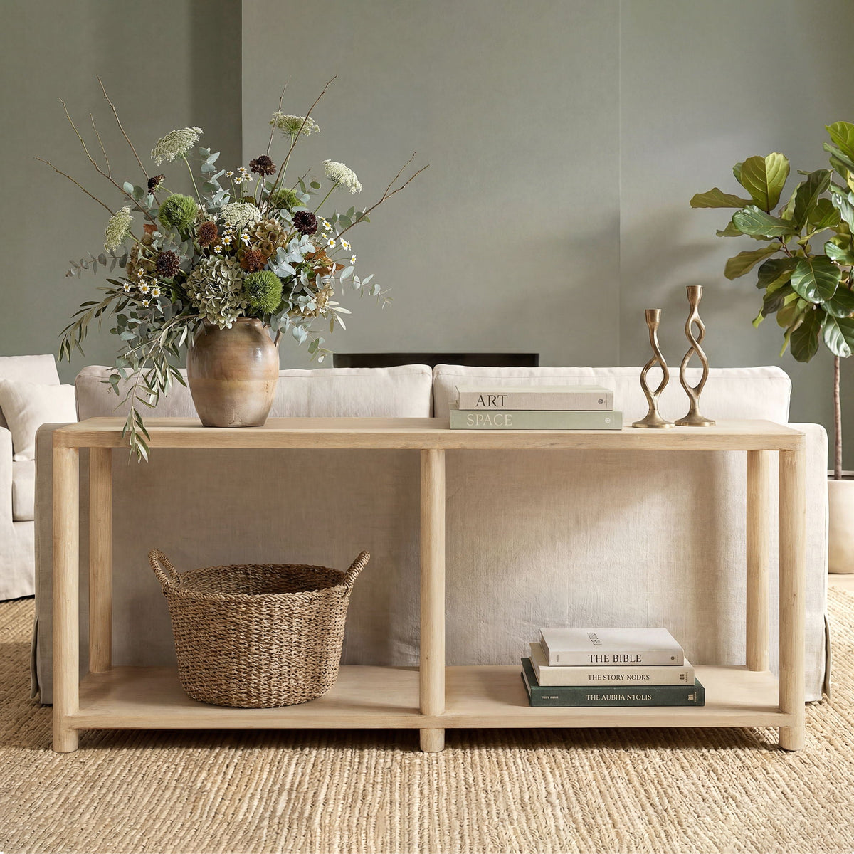 Natural reclaimed wood console table with lower shelf in a calm living room setting on Tampa Home & Garden Store