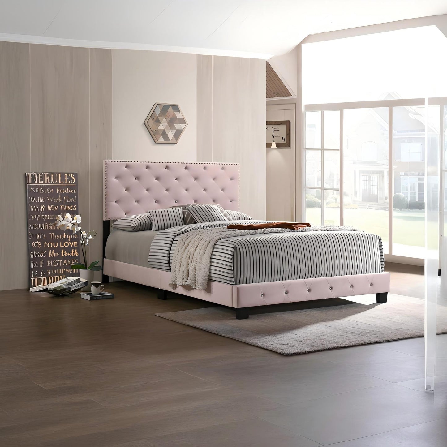 Luxurious upholstered bed by HouseOfZazla with pale pink tufted headboard and striped bedding on Tampa Home & Garden Store