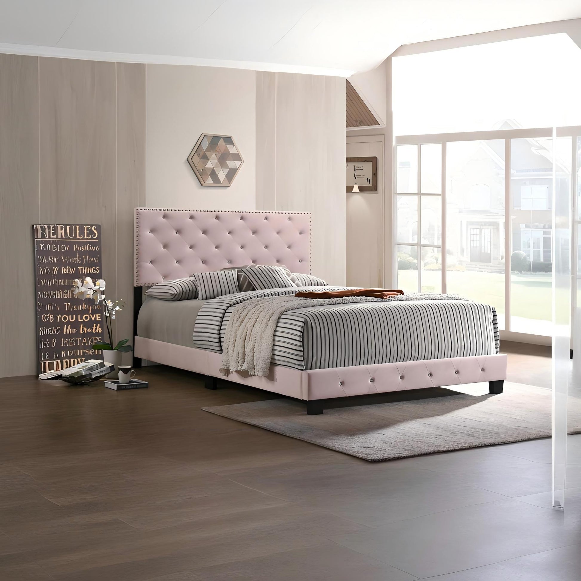 Luxurious upholstered bed by HouseOfZazla with pale pink tufted headboard and striped bedding on Tampa Home & Garden Store