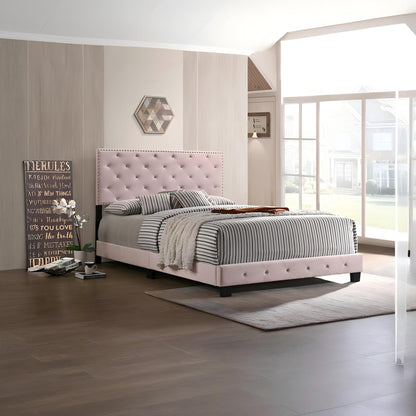 Luxurious upholstered bed by HouseOfZazla with pale pink tufted headboard and striped bedding on Tampa Home & Garden Store