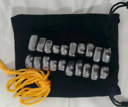 Magnetic travel chess set with silver pieces on a black pouch with yellow cords Moktan Sabai on Tampa Home & Garden Store