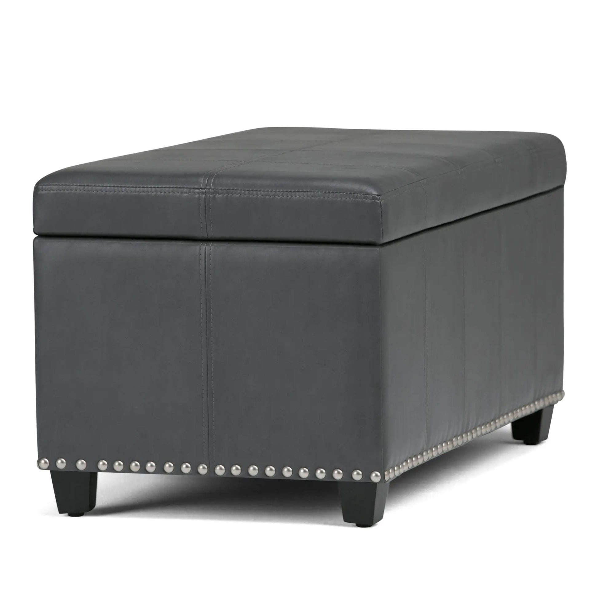 Amelia storage ottoman bench in gray faux leather with stitched top panels and studded base on Tampa Home & Garden Store