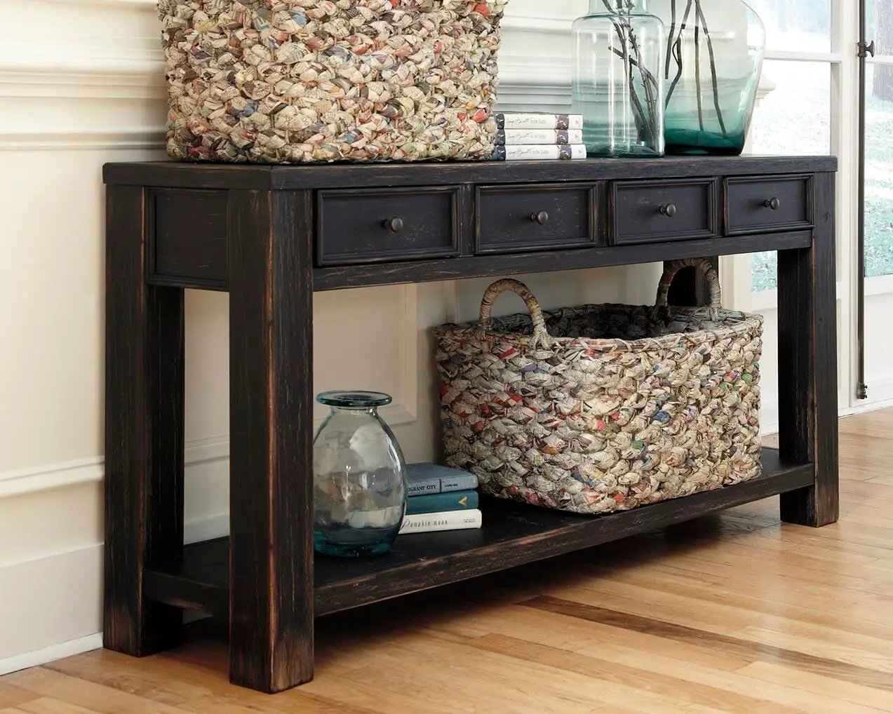 Gavelston black sofa table with distressed finish, four drawers and lower shelf on Tampa Home & Garden Store