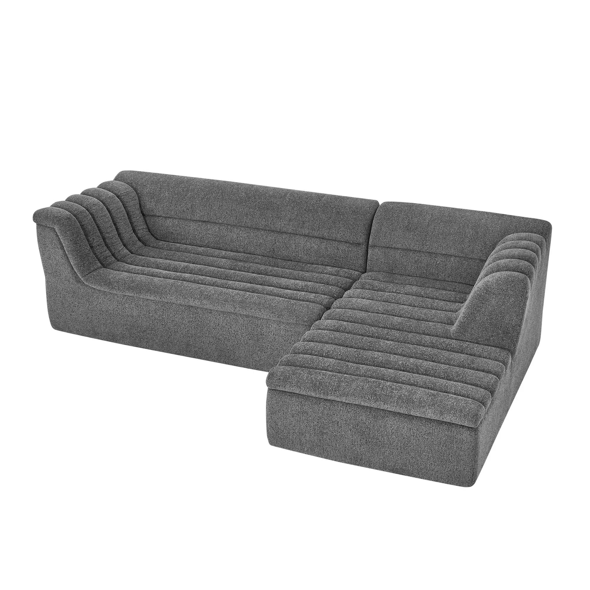 Upholstered L-shaped modular sectional sofa with chaise and wave-shaped arms in gray fabric on Tampa Home & Garden Store
