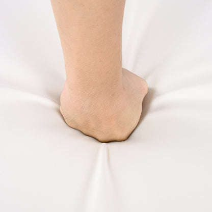 Bare ankle and lower leg close-up resting on white fabric background on Tampa Home & Garden Store