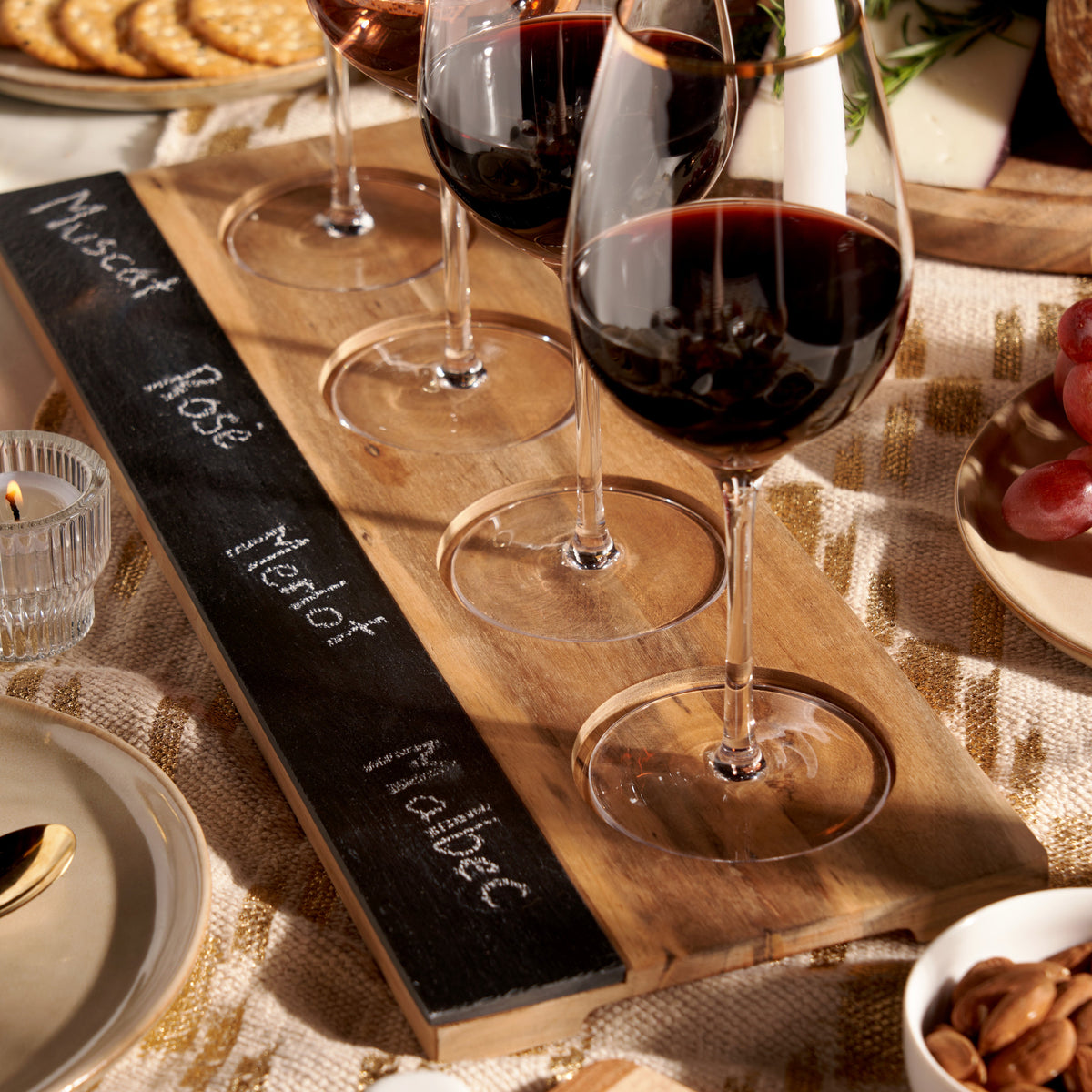 Acacia wood wine flight board by Twine Living with black slate insert and wine glasses on Tampa Home & Garden Store