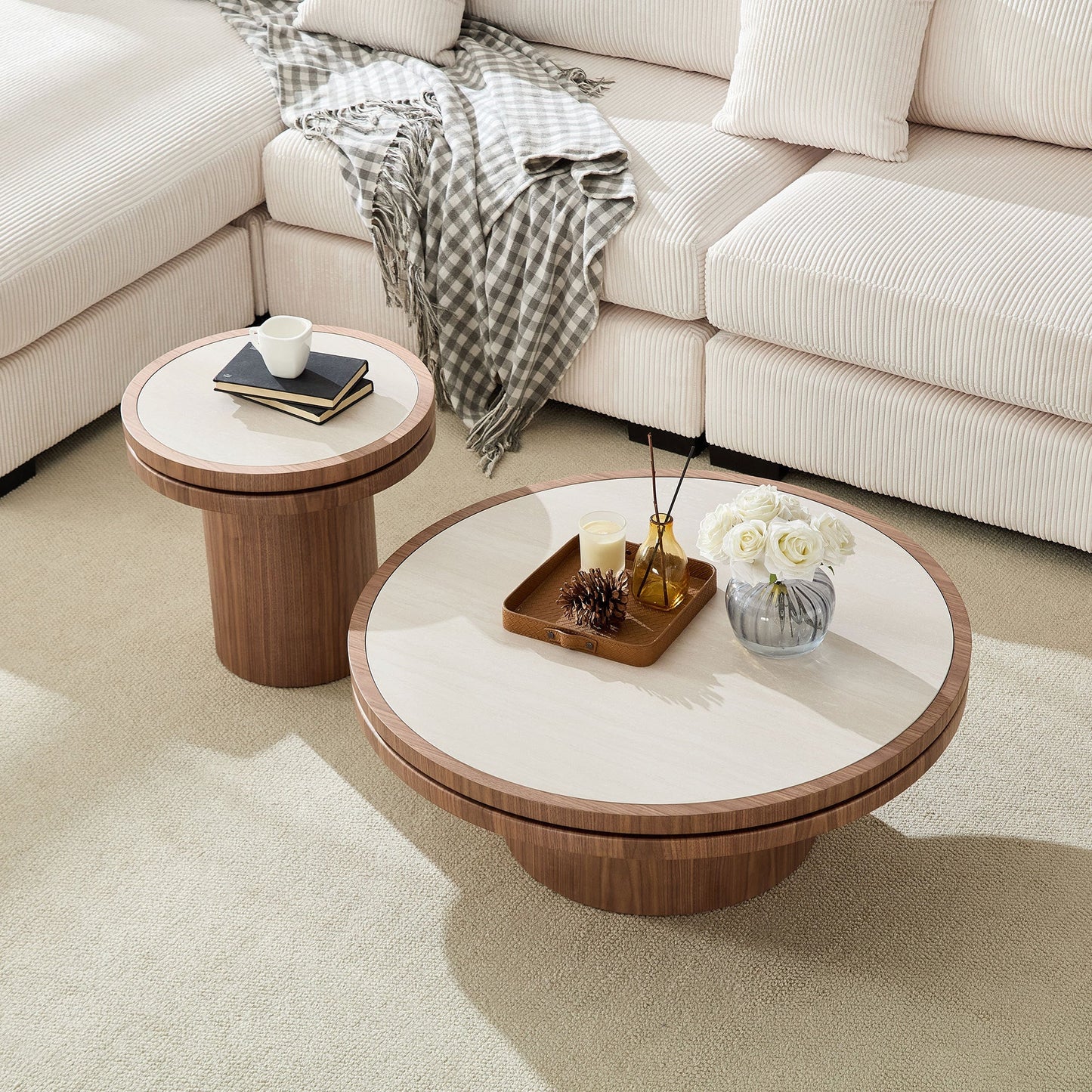 Two round coffee tables with sintered stone walnut tops in a beige sectional living room on Tampa Home & Garden Store