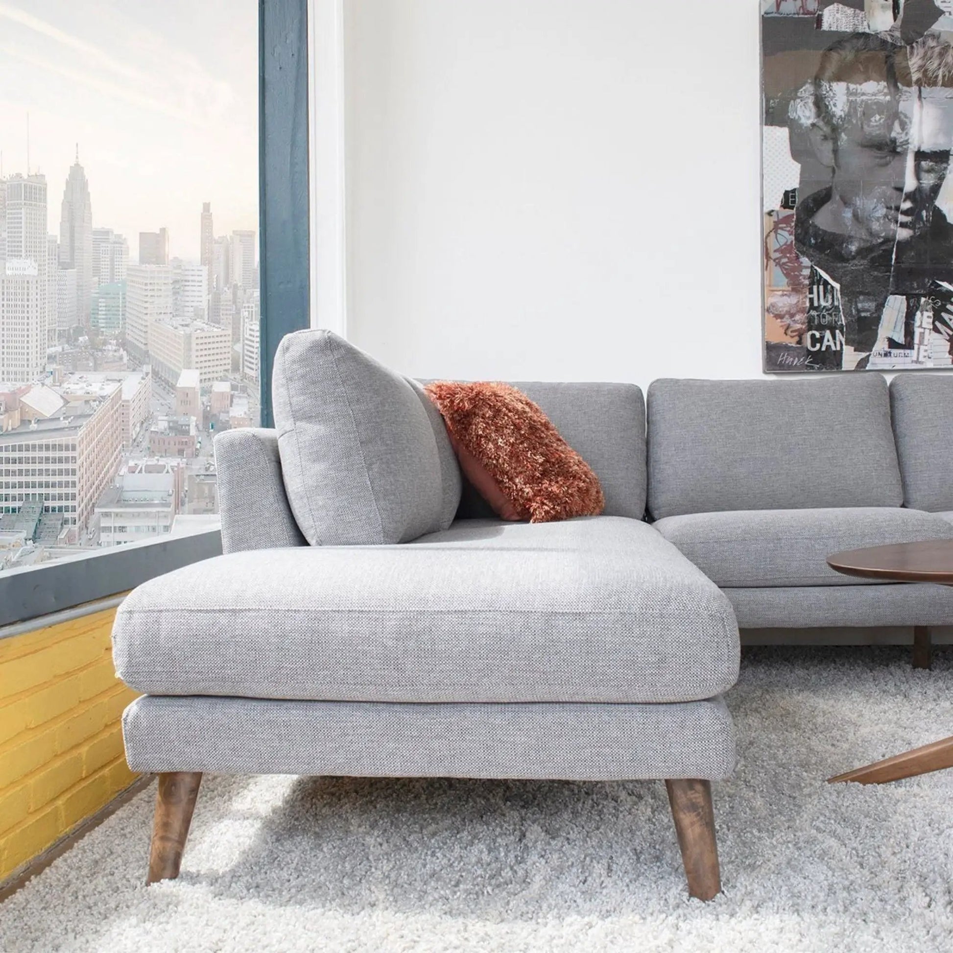 Benson sectional sofa with chaise in light gray fabric, wooden legs on Tampa Home & Garden Store