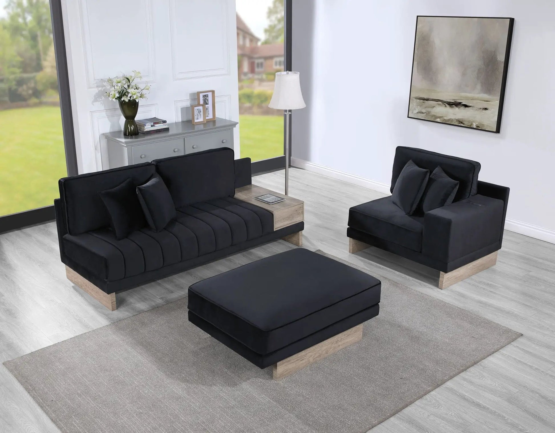 Memphis reversible sectional with black fabric upholstery and light wood base ottoman on Tampa Home & Garden Store