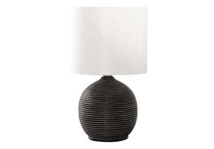Table lamp with black ribbed resin base and white fabric shade on Tampa Home & Garden Store