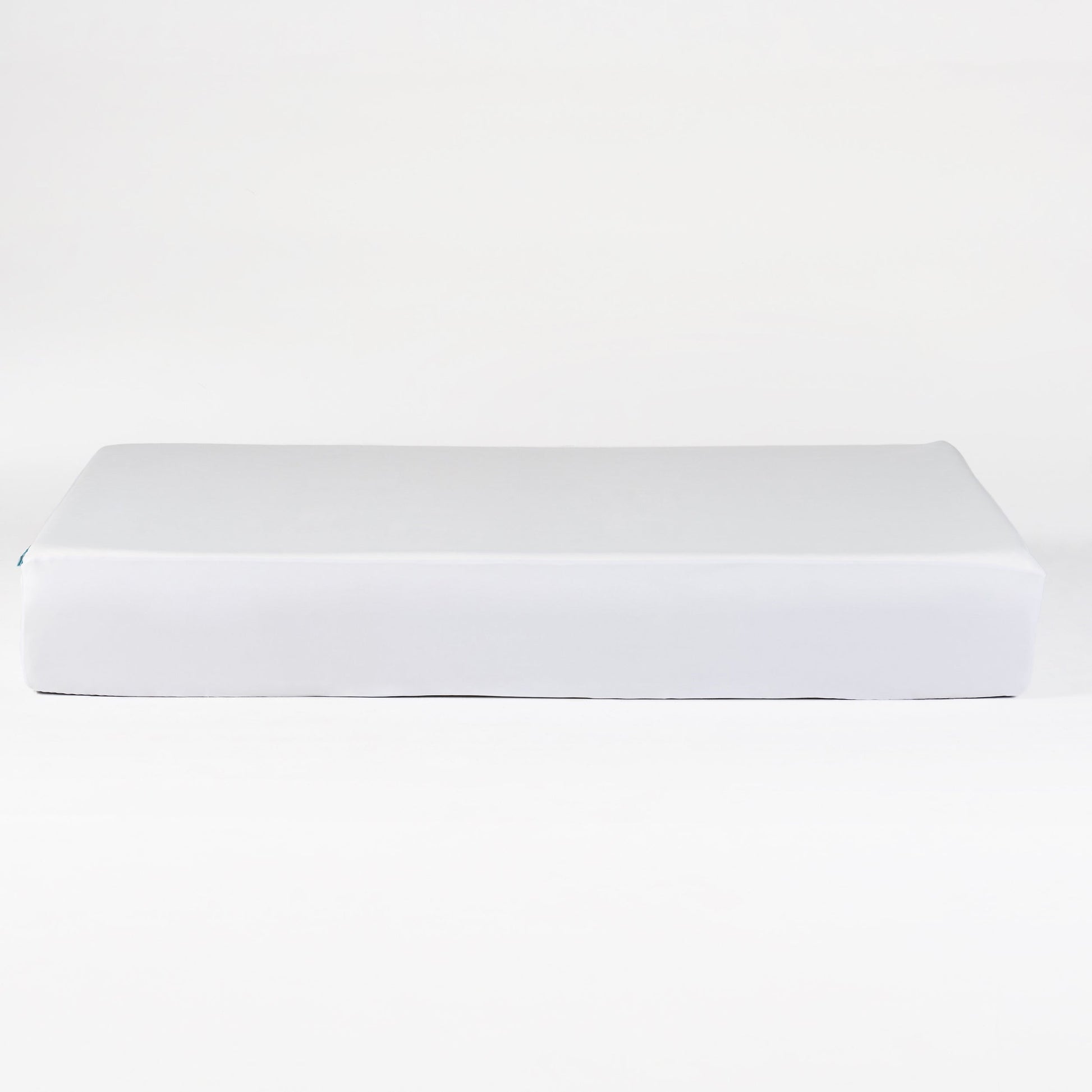 OkiOki Queen Mattress Protector in white packaging placed on a bed for protection on Tampa Home & Garden Store