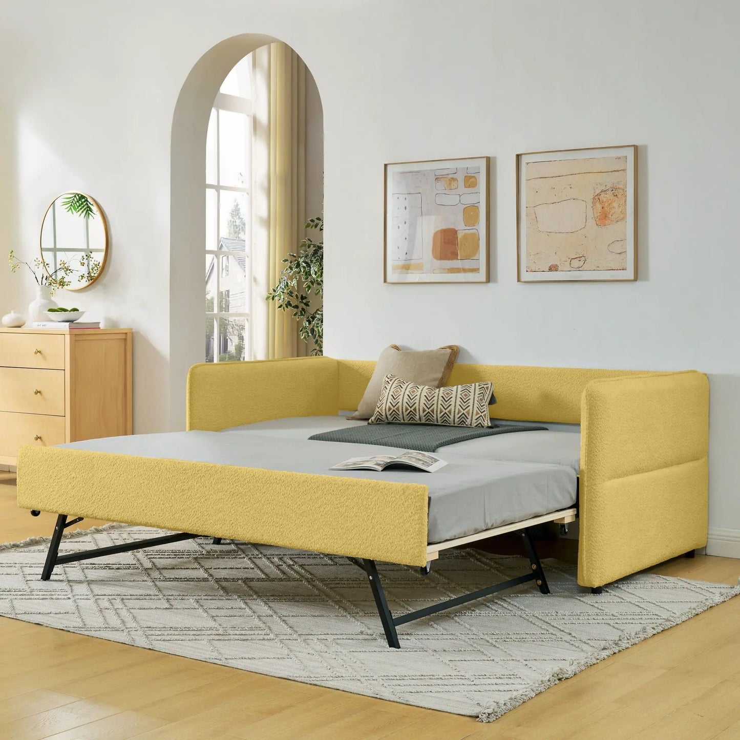 Upholstered daybed with pop-up trundle in yellow fabric and black metal legs on Tampa Home & Garden Store