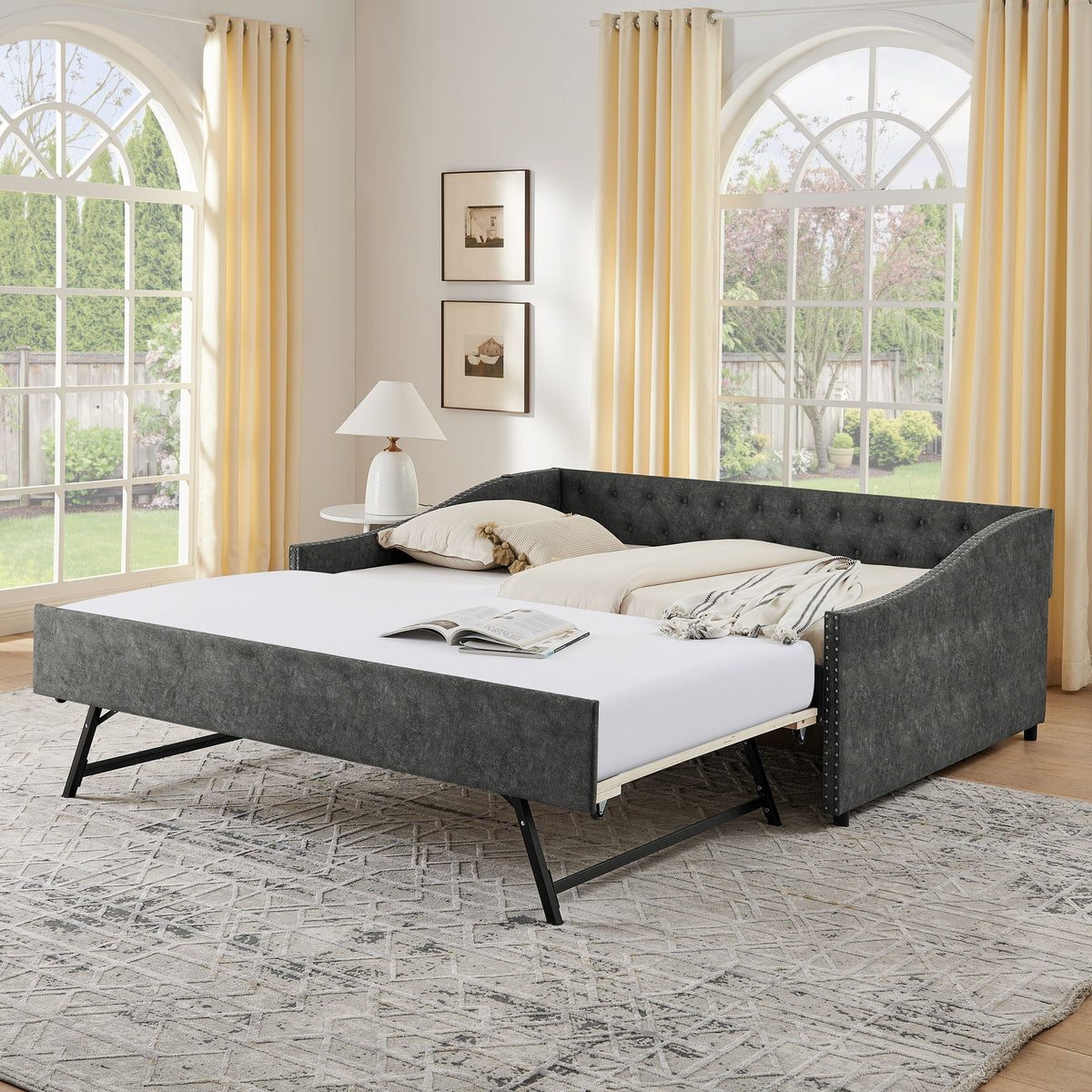 Upholstered daybed with pull-out bed in gray fabric, tufted frame, two beds on Tampa Home & Garden Store