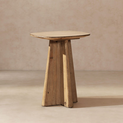 End table in antique brown wood with a sculptural pedestal base and oval top on Tampa Home & Garden Store