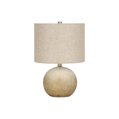 Table lamp Unique Piece Furniture with beige linen shade atop speckled ceramic base on Tampa Home & Garden Store