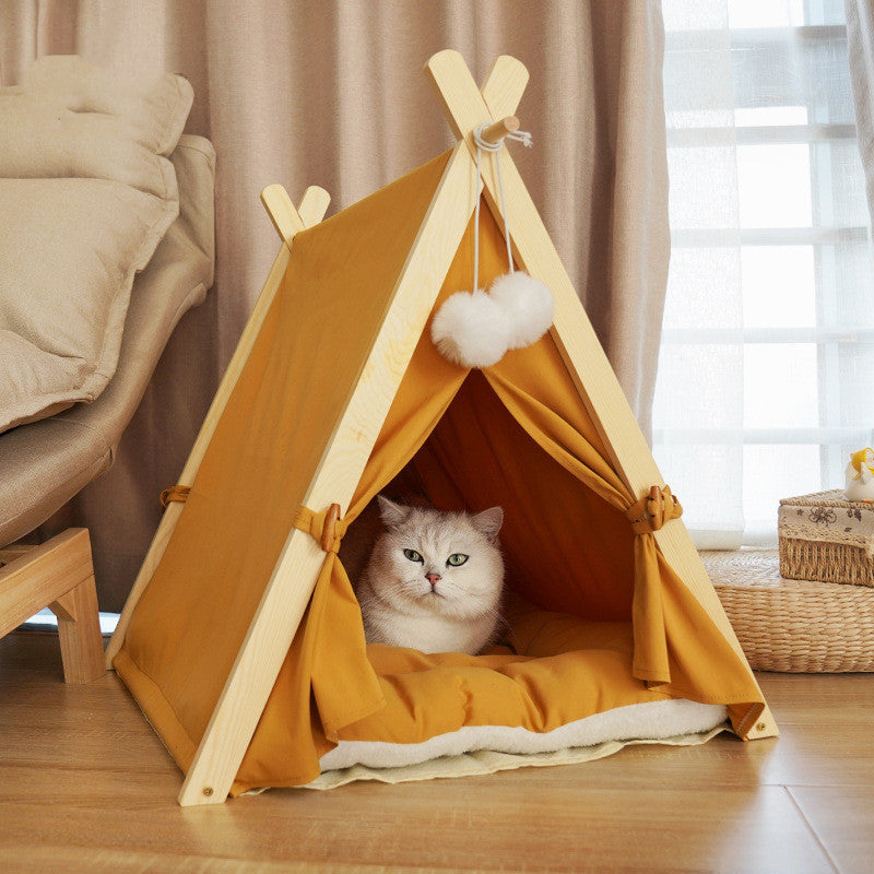 Pet tent with a light wood frame and orange canvas, cat lounging inside on plush bed on Tampa Home & Garden Store