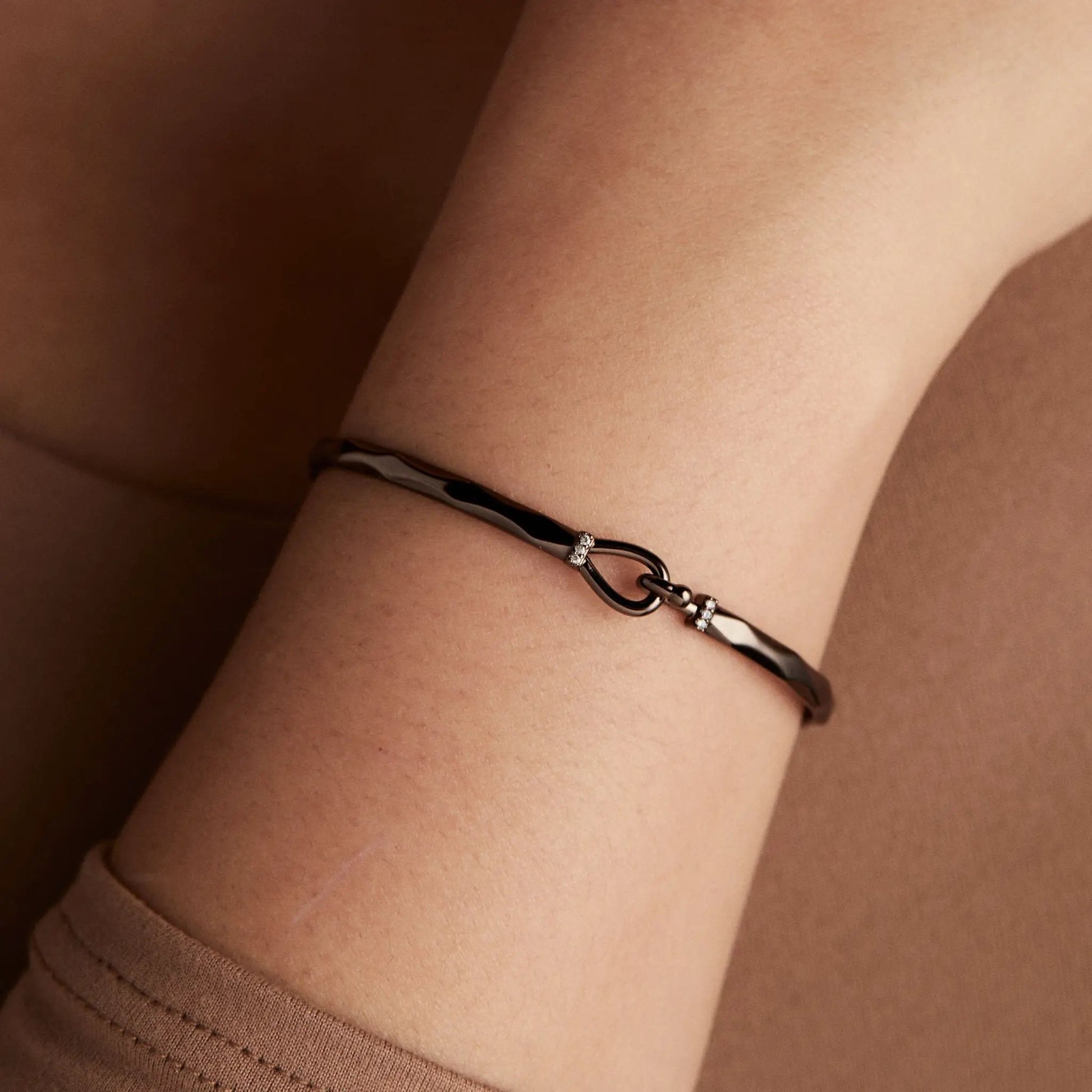 Faceted Hook Tension Bracelet by ALEX AND ANI in dark metal with crystal accents on wrist on Tampa Home & Garden Store