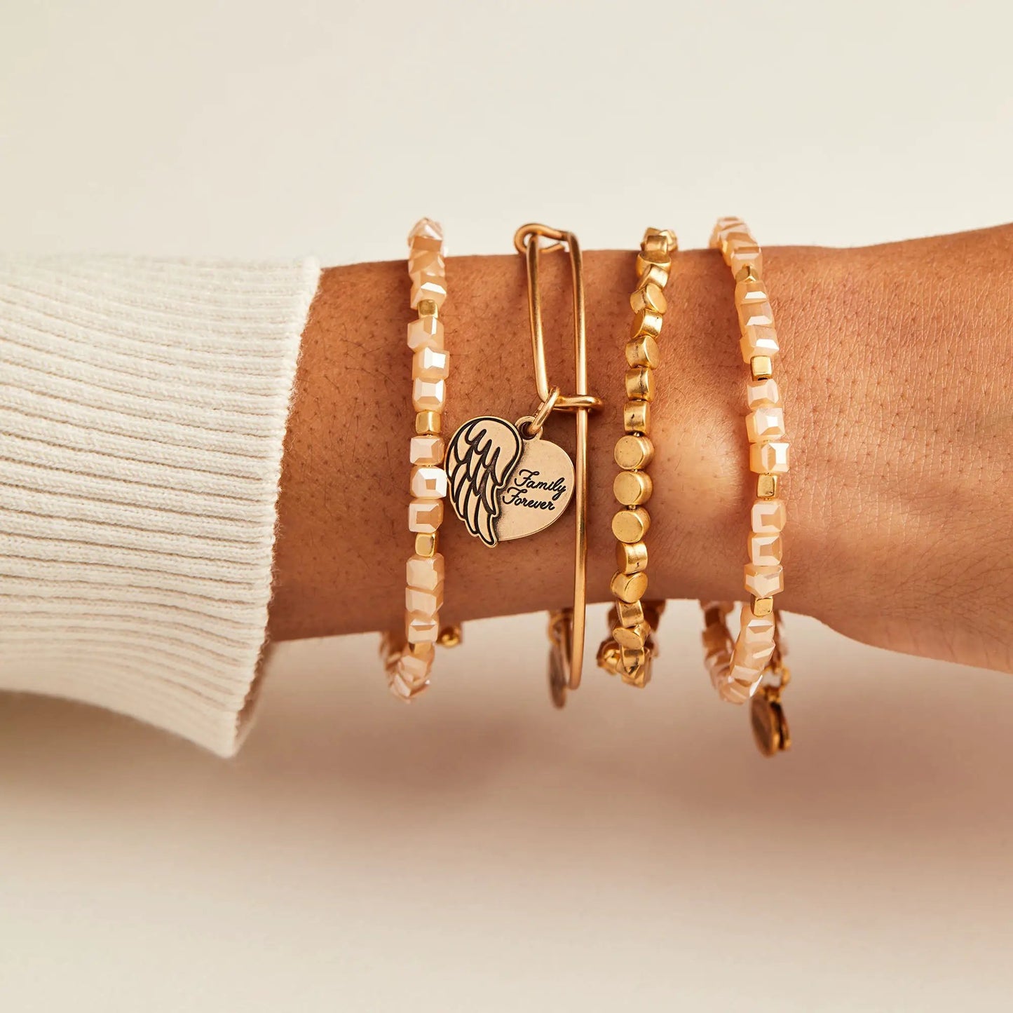 ALEX AND ANI Family Forever angel wing heart charm bracelet stack with peach faceted beads on Tampa Home & Garden Store