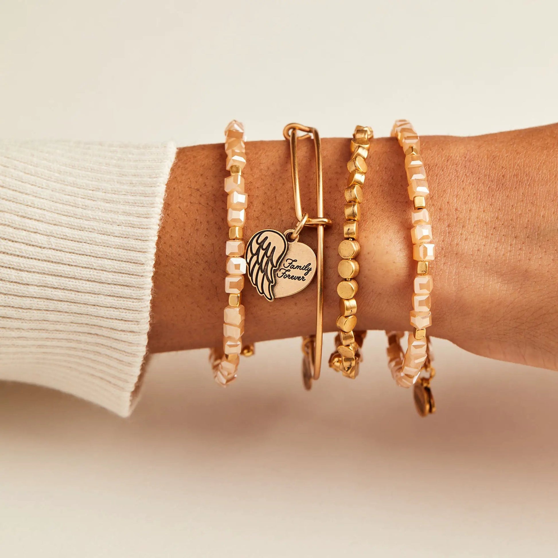 ALEX AND ANI Family Forever angel wing heart charm bracelet stack with peach faceted beads on Tampa Home & Garden Store