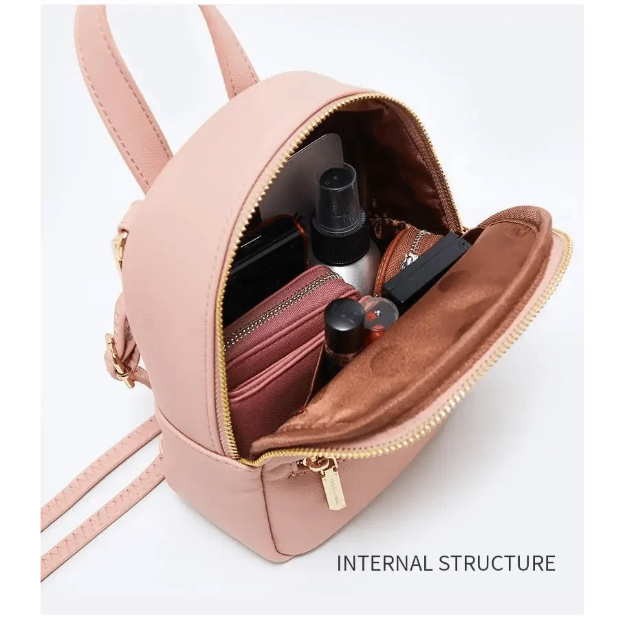 Stevvex pink mini soft-touch leather backpack with interior makeup items on Tampa Home & Garden Store