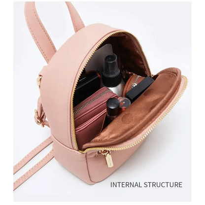 Stevvex pink mini soft-touch leather backpack with interior makeup items on Tampa Home & Garden Store