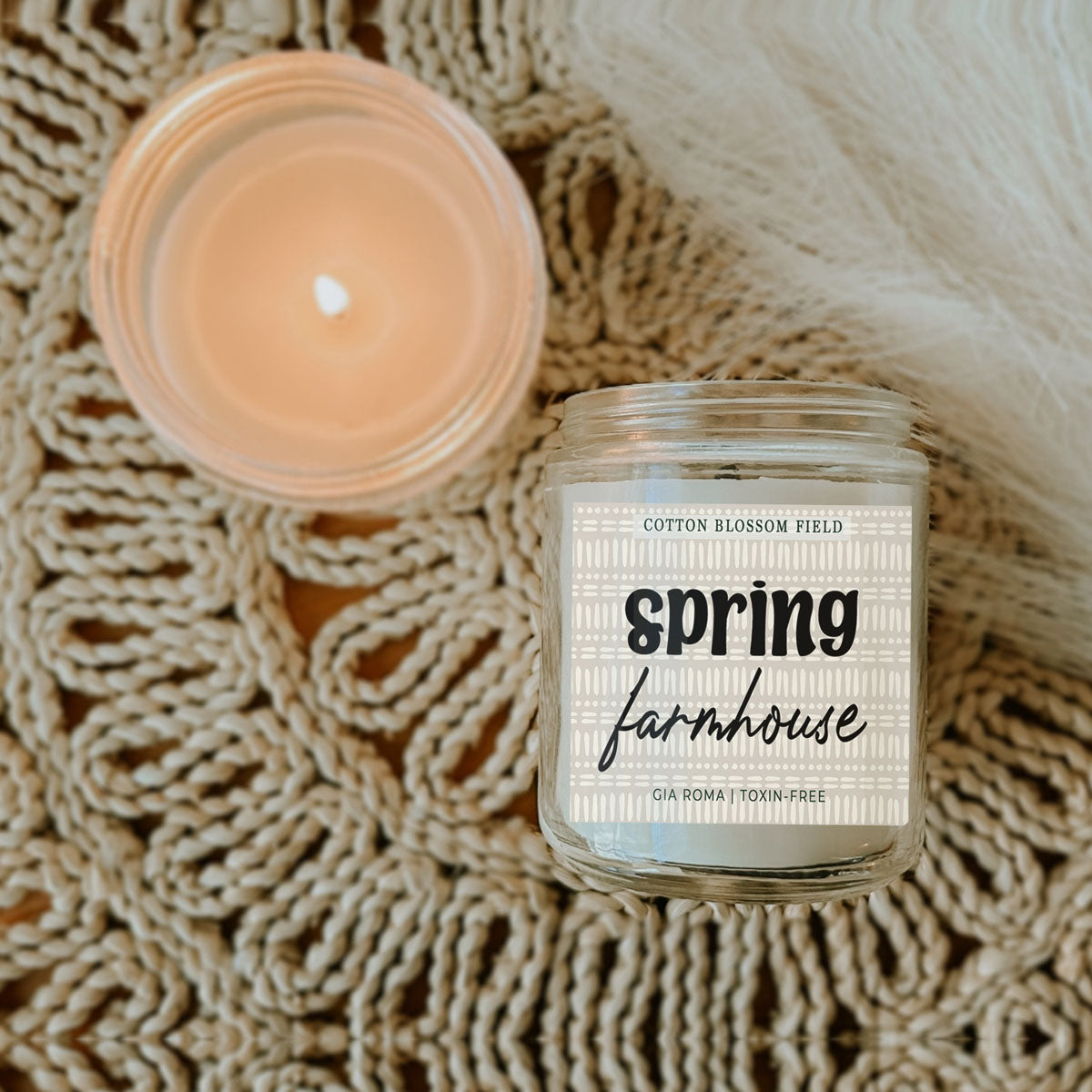 Cotton Blossom Candle Gia Roma in a clear glass jar with spring farmhouse label and warm glow on Tampa Home & Garden Store