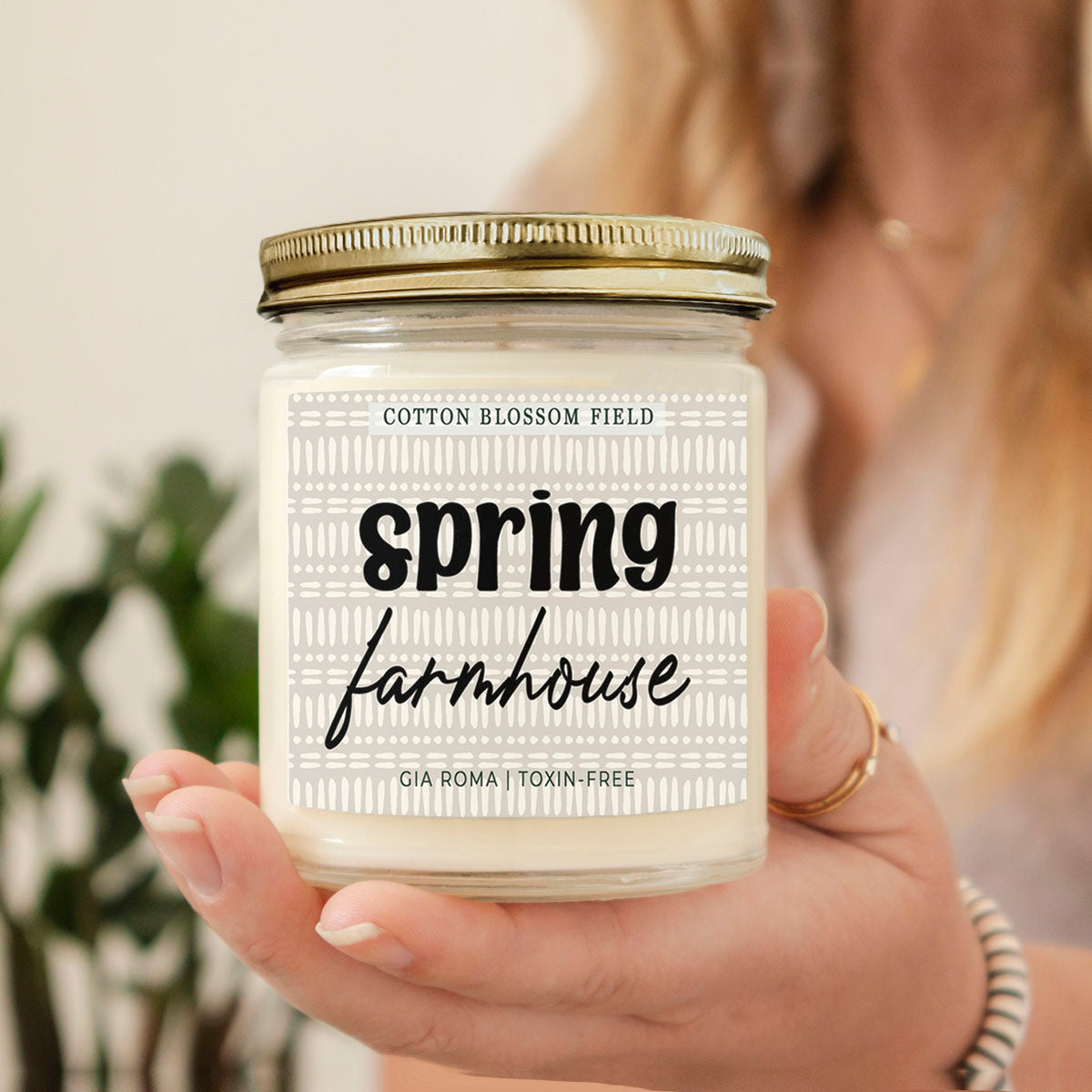 Cotton Blossom Candle by Gia Roma in a clear glass jar with a gold lid and white wax, label reads spring farmhouse on Tampa Home & Garden Store