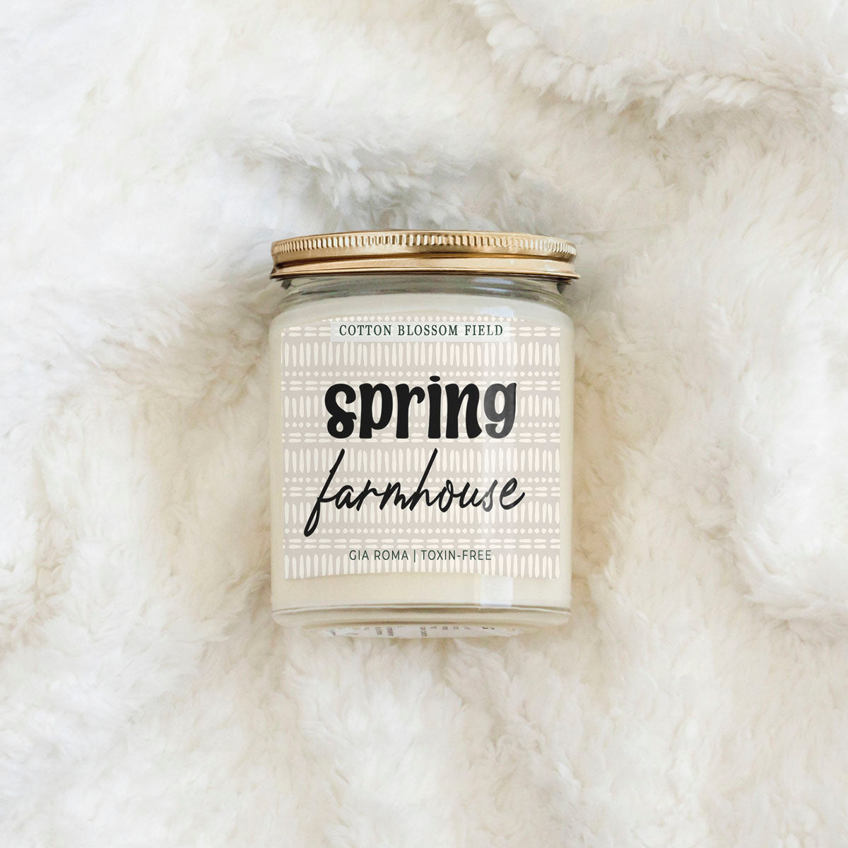 Gia Roma Cotton Blossom Candle in a clear glass jar with copper lid on Tampa Home & Garden Store