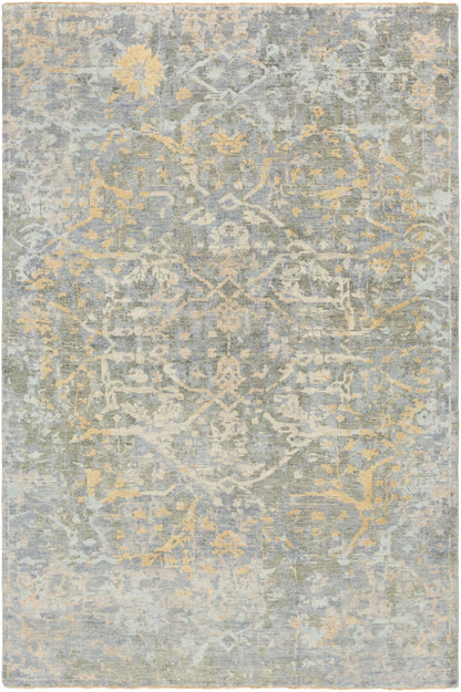 Farmingville Area Rug by Boutique Rugs in blue-gray with pale yellow floral distressing on Tampa Home & Garden Store