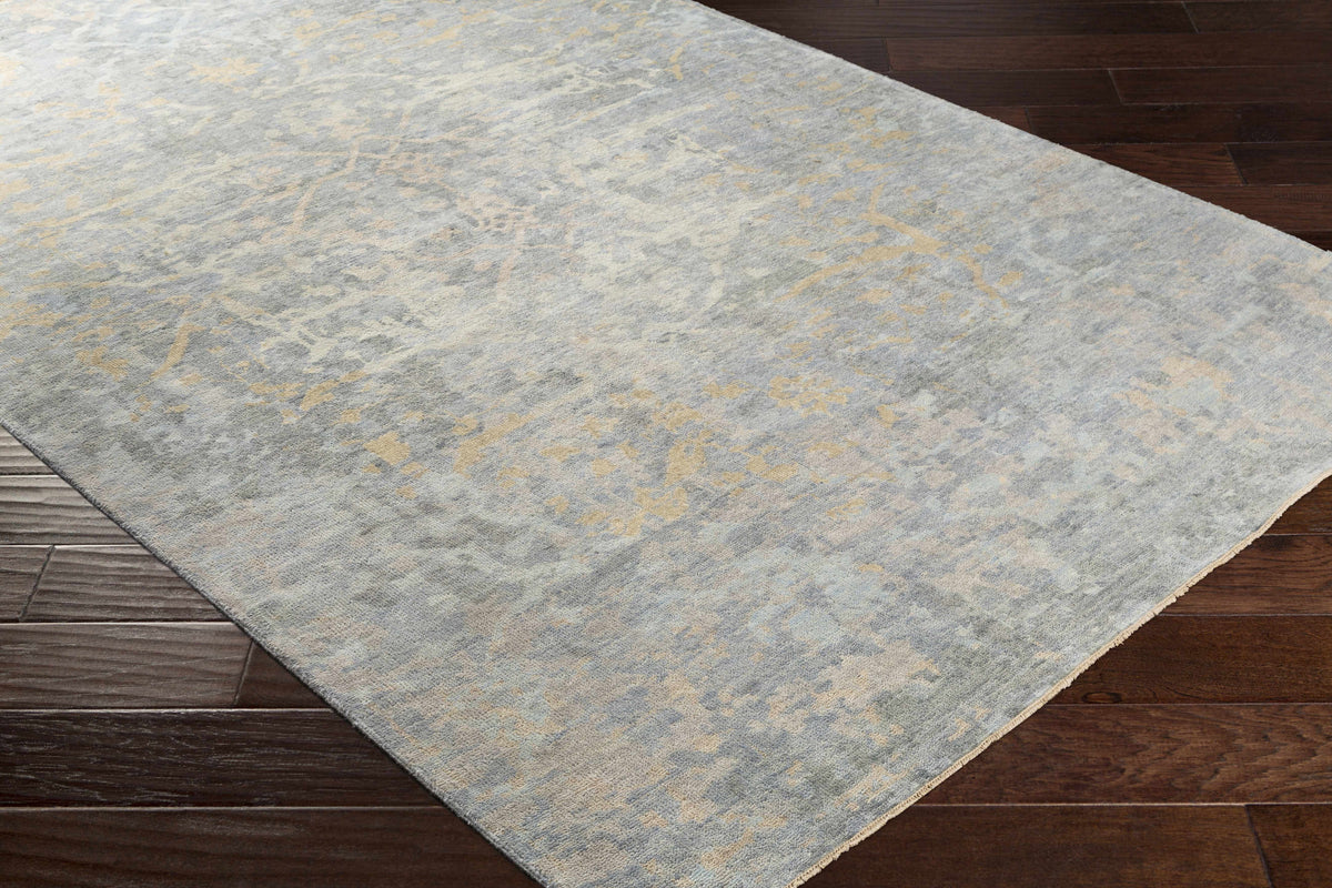 Farmingville Area Rug - Clearance, gray-blue rug with gold marbling Boutique Rugs on wood floor on Tampa Home & Garden Store