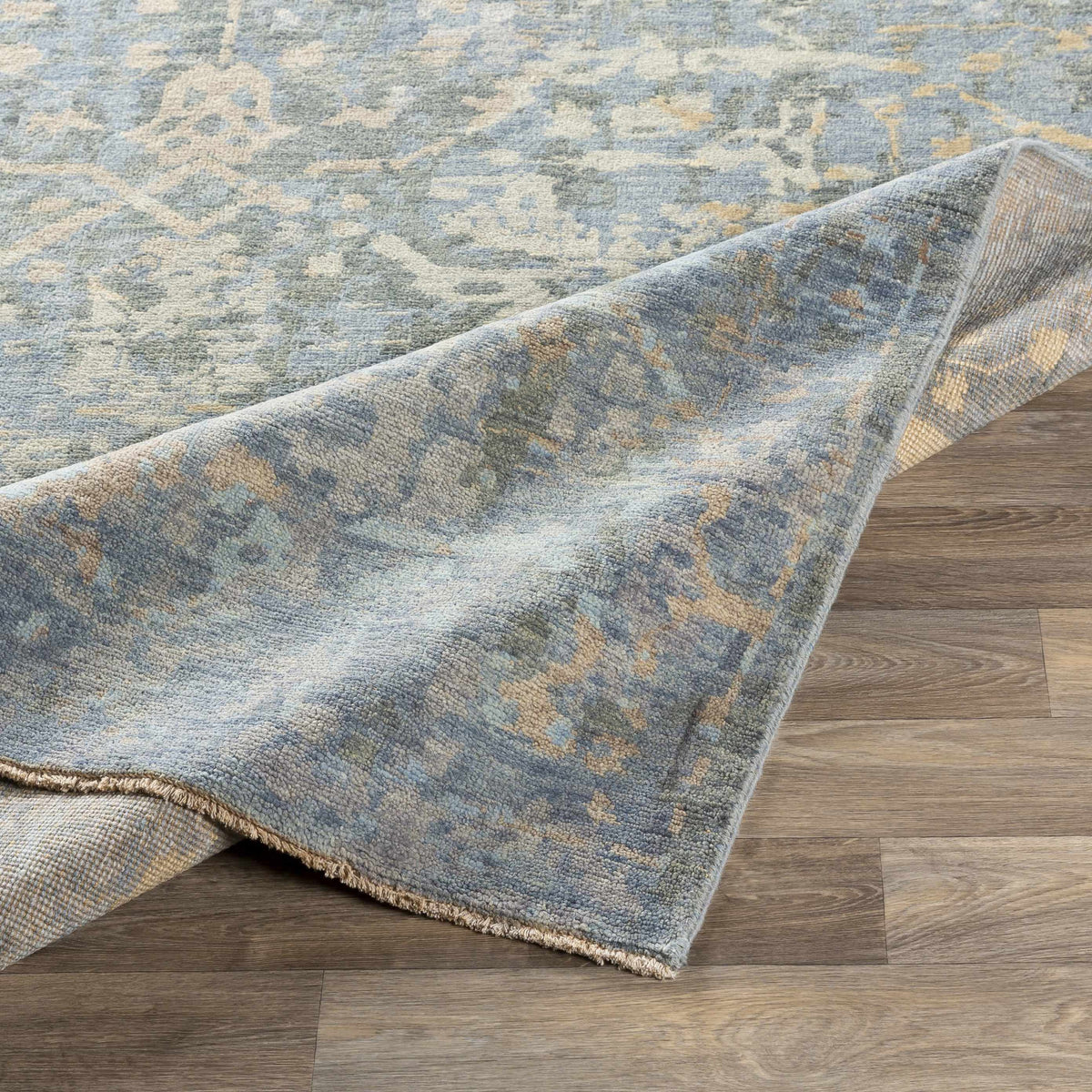 Farmingville Area Rug blue-gray palette with beige accents, soft textured with fringed edges on Tampa Home & Garden Store