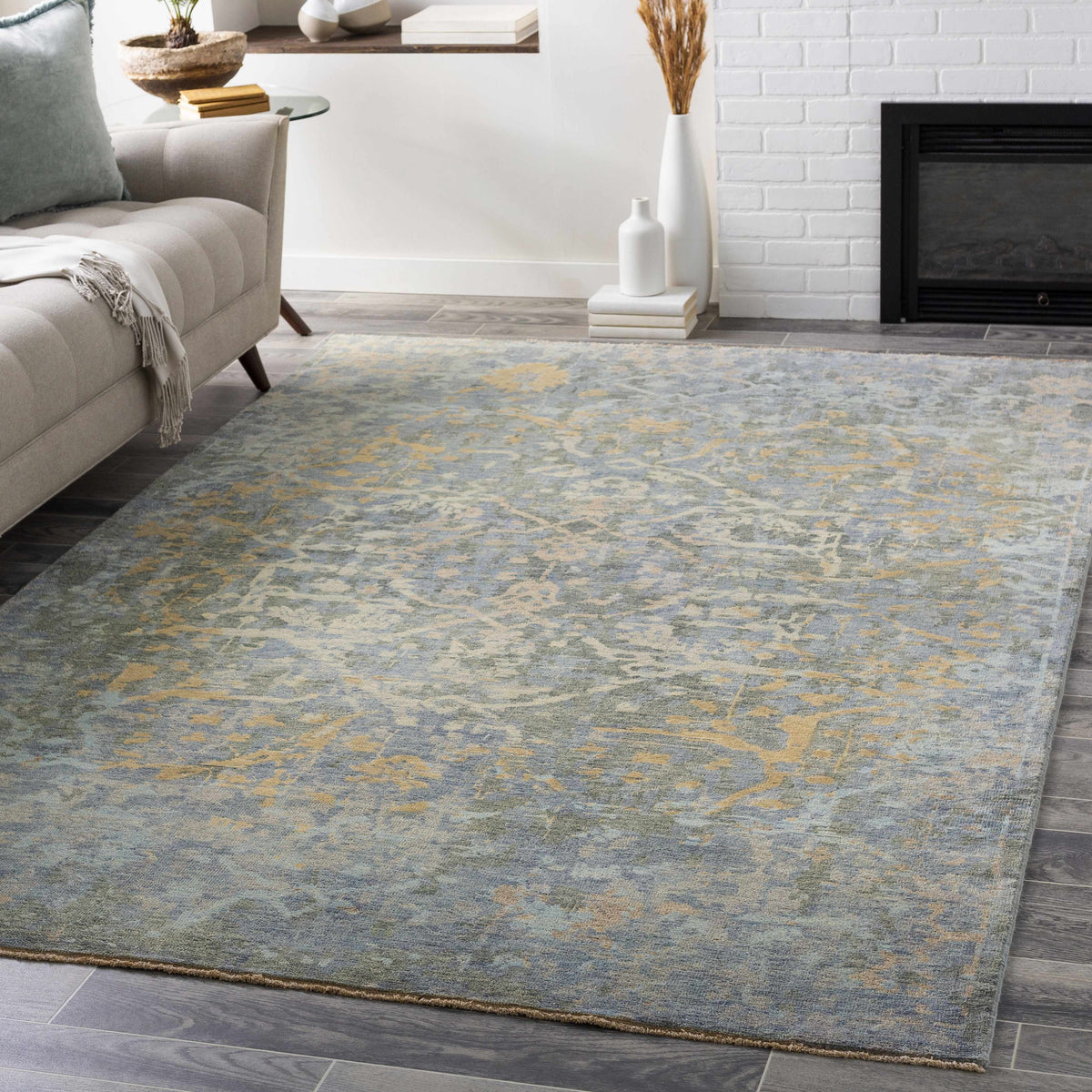 Farmingville Area Rug by Boutique Rugs, blue gray field with subtle yellow highlights in a modern living room on Tampa Home & Garden Store
