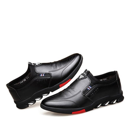 Stevvex black leather men's casual slip-on sneakers pair with white sole and red accents on Tampa Home & Garden Store