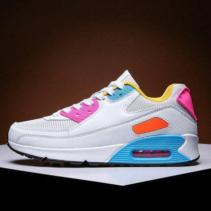 Athletic running shoes Stevvex white sneakers with pink accents, blue heel, yellow lining on Tampa Home & Garden Store
