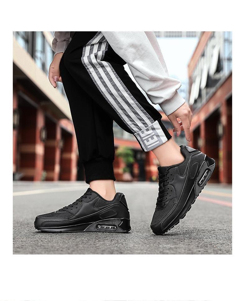 Stevvex black lace-up unisex athletic running shoes pair, breathable mesh upper on Tampa Home & Garden Store