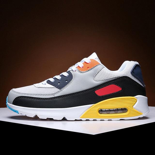 Stevvex athletic running shoes white mesh upper black panel yellow midsole orange lace accent on Tampa Home & Garden Store
