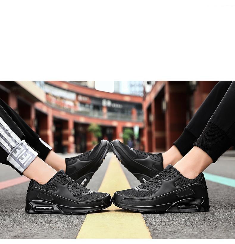 Stevvex black unisex athletic running shoes two pairs shown on street with yellow line on Tampa Home & Garden Store