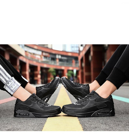 Stevvex black unisex athletic running shoes two pairs shown on street with yellow line on Tampa Home & Garden Store