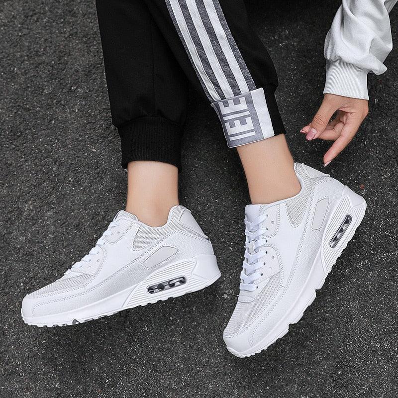 Stevvex white lace-up athletic sneakers with mesh upper and visible air cushion sole pair on Tampa Home & Garden Store