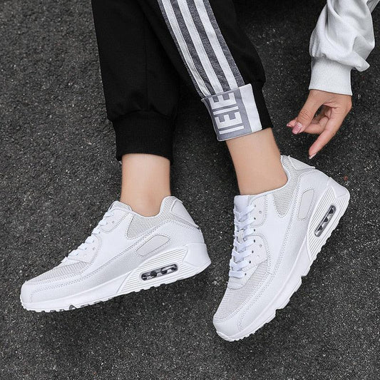 Stevvex white lace-up athletic sneakers with mesh upper and visible air cushion sole pair on Tampa Home & Garden Store