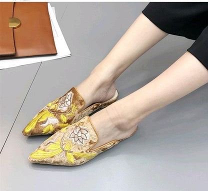 Women slip-on mules by Stevvex with embroidered flower details in gold yellow tones on Tampa Home & Garden Store