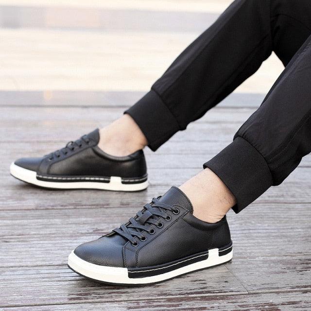 Stevvex men's black leather sneakers pair with white sole for casual walking on Tampa Home & Garden Store