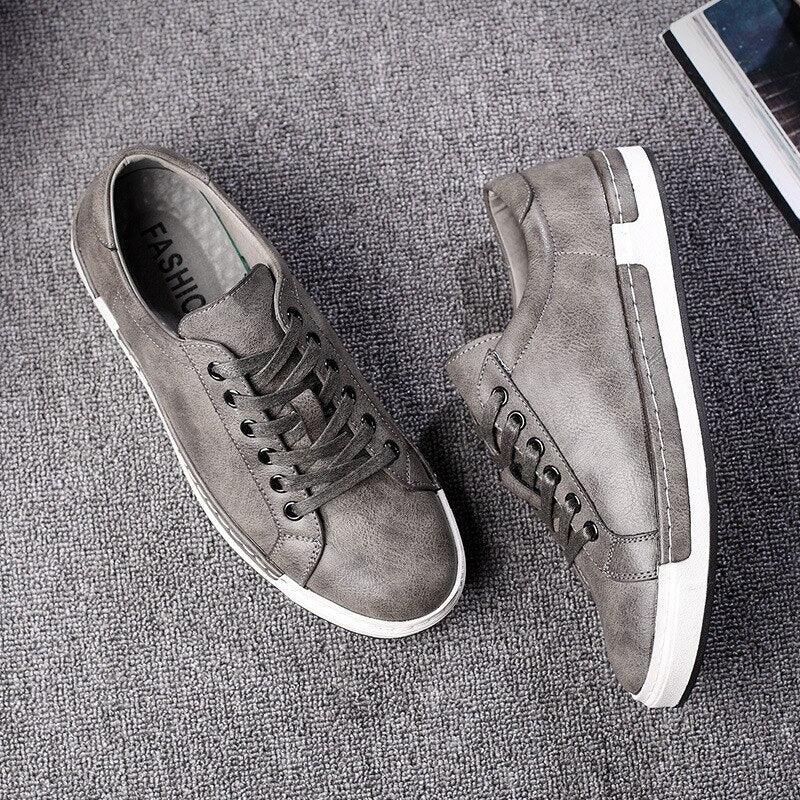 Pair of fashion leather men's sneakers by Stevvex in grey with white sole on Tampa Home & Garden Store