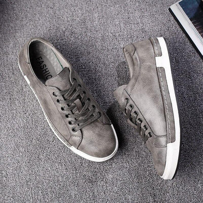 Pair of fashion leather men's sneakers by Stevvex in grey with white sole on Tampa Home & Garden Store