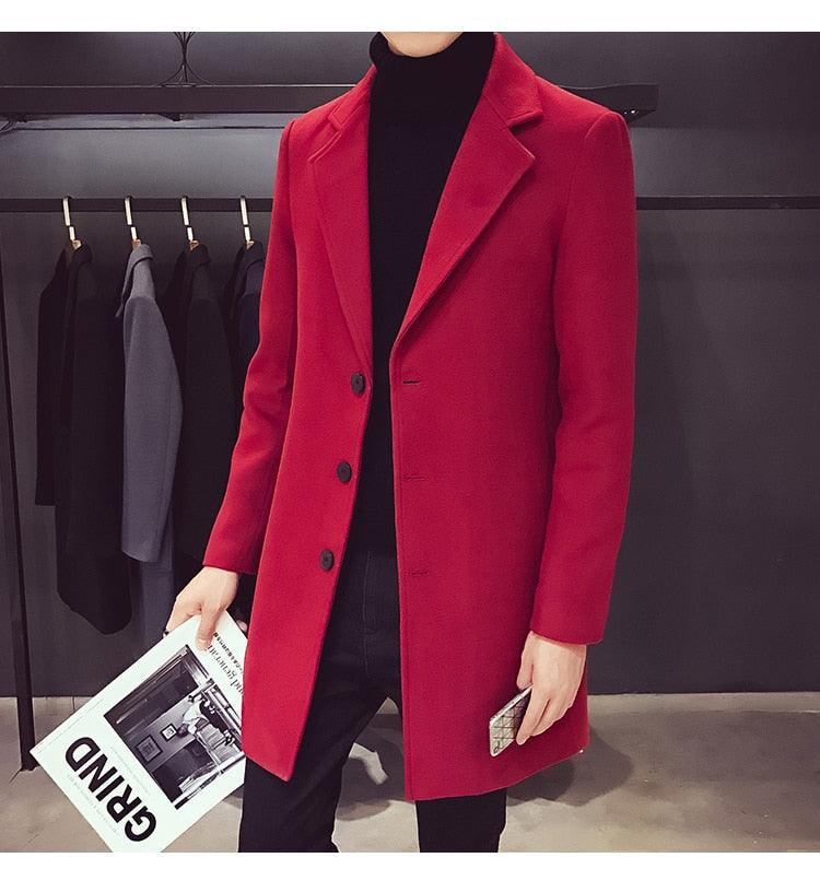 Stevvex red trench coat, long coat worn over black turtleneck in store on Tampa Home & Garden Store