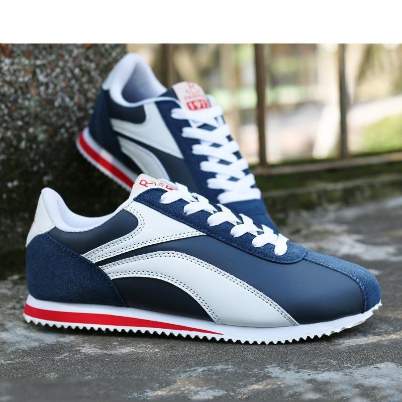 Stevvex athletic sneakers, blue and white with red sole stripe, 2 sneakers shown on Tampa Home & Garden Store