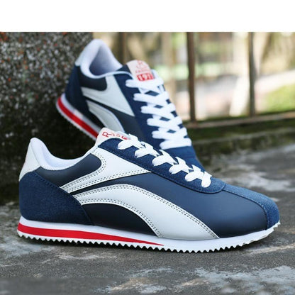 Stevvex athletic sneakers, blue and white with red sole stripe, 2 sneakers shown on Tampa Home & Garden Store